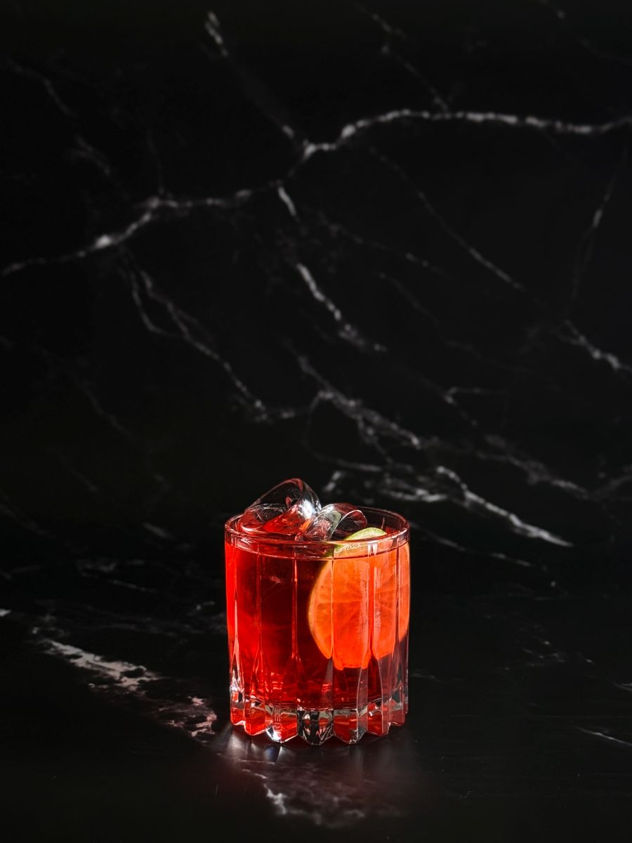Kosci Sunset cocktail with cranberry and lime